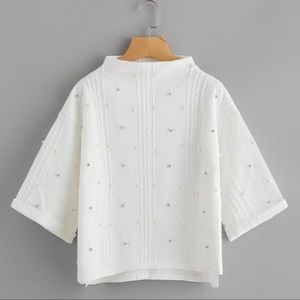 White Pearls turtle neck top.  Brand new.